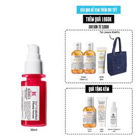A vibrant red bottle of Kiehl's Hydro-Plumping Serum with a white pump dispenser. The product is centered against a plain white background, highlighting its bold packaging and label.​
